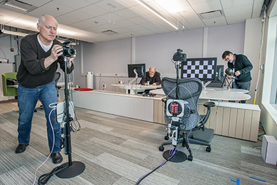 Gerald Robinson and Henry Coles set up testing equipment for the experiment